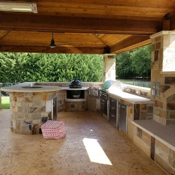 Prosper - Freestanding patio with outdoor kitchen, fireplace and firepit.
