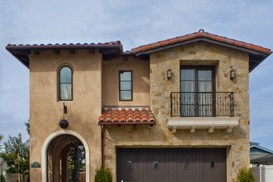 Mediterranean brown two-story exterior home idea in Los Angeles