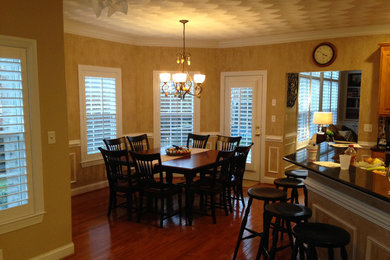 Inspiration for a dining room remodel in Other with white walls