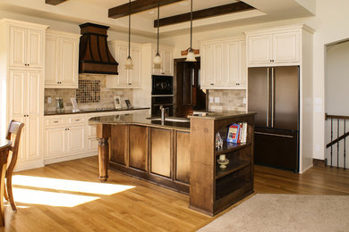 Inspiration for a large timeless l-shaped light wood floor eat-in kitchen remodel in Minneapolis with an undermount sink, beaded inset cabinets, white cabinets, quartz countertops, multicolored backsplash, stone tile backsplash, colored appliances and an island