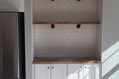 Example of a classic kitchen design in Other