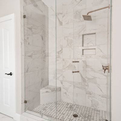 Mid-sized transitional master white tile and porcelain tile porcelain tile, white floor and double-sink bathroom photo in Charlotte with furniture-like cabinets, gray cabinets, gray walls, an undermount sink, quartz countertops, a hinged shower door, white countertops and a freestanding vanity