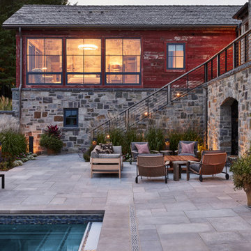 Antique Red and Weathered Gray Barnwood Paneling on Farmhouse Pool Terrace