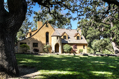 Mid-sized traditional brown two-story stucco gable roof idea in San Francisco