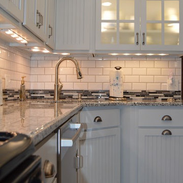 Gray Transitional Kitchen in Rustic Log Home by McLusky Showcase Kitchens & Bath