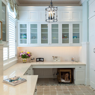 Inspiration for a classic utility room in Miami with white cabinets, beige floors and beige worktops.