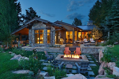 Design ideas for a large arts and crafts backyard patio in Salt Lake City with a fire feature, natural stone pavers and no cover.