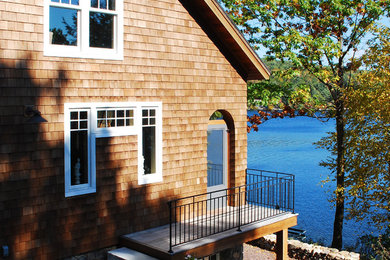 Large transitional brown split-level wood exterior home idea in Boston with a shingle roof