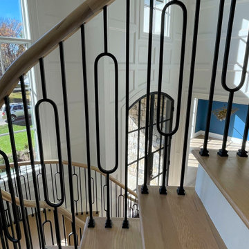 Project #95 | Freestanding Elliptical Staircase with Geometric Iron Balusters