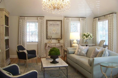 Example of a mid-sized eclectic open concept beige floor and medium tone wood floor living room design in New York with beige walls, a standard fireplace and a brick fireplace