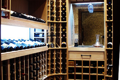 Traditional wine cellar with display rack and custom lighting