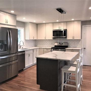 white shaker cabinets with gray island