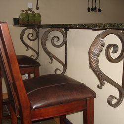 Hand Forged Iron Leaf Brackets under Granite - Brackets