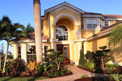 Tuscan home design photo in Miami