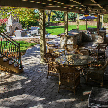 Outdoor Kitchen With Dining Table, Fine Patio, and Stone Kitchen Set