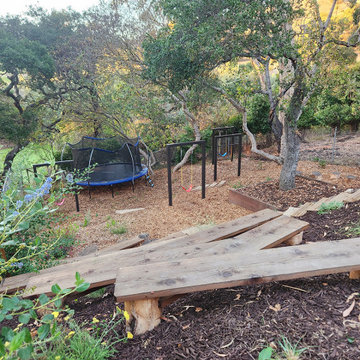 Reclaimed wood planks allow playful passage down to lower terrace