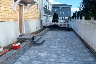 Example of a mid-sized beach style backyard concrete paver patio kitchen design in Other with no cover