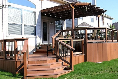 Inspiration for a mid-sized timeless backyard deck remodel in Austin with a pergola