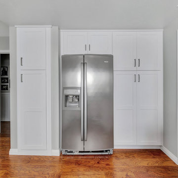 Sleek Refrigerator Wall with Custom Cabinetry