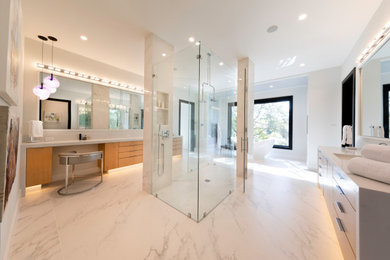 Huge minimalist master white tile and porcelain tile porcelain tile, white floor and double-sink bathroom photo in Other with flat-panel cabinets, light wood cabinets, a bidet, white walls, an undermount sink, quartz countertops, a hinged shower door, white countertops and a built-in vanity