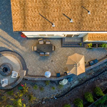 Dual patio with adjoining firepit feature