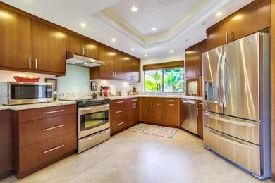 Photo of a contemporary u-shaped kitchen in San Diego with no island, beige floor and white benchtop.