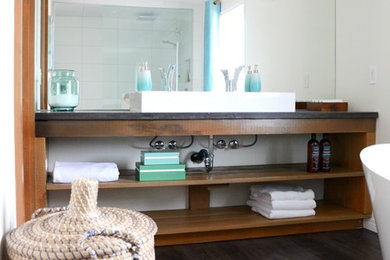 Example of a mid-sized danish master white tile and ceramic tile dark wood floor and brown floor bathroom design in Calgary with open cabinets, dark wood cabinets, soapstone countertops, white walls and a trough sink