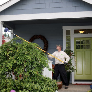Croach Pest Control for Returning Customers - Pest Control Technician on Porch