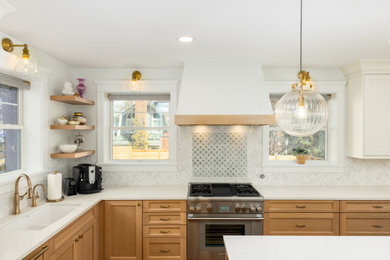 Large transitional l-shaped medium tone wood floor and brown floor eat-in kitchen photo in Denver with an undermount sink, shaker cabinets, light wood cabinets, quartz countertops, white backsplash, mosaic tile backsplash, paneled appliances, an island and white countertops
