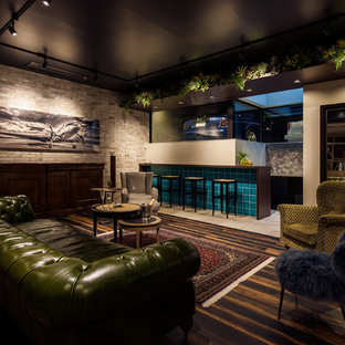 Inspiration for a contemporary look-out basement with grey walls, painted wood flooring and brown floors.