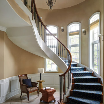Curved staircase with Blue Wool Runner