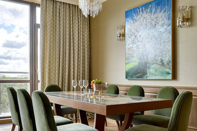 Photo of a transitional dining room in Moscow with beige walls, medium hardwood floors and brown floor.