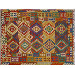Bareens Designer Rugs - Bohemian Turkish Kilim Annelies Hand-Woven Wool Rug - 5'10'' x 7'9'' - Elevate the elegance of your home with this stunning hand-woven tribal Kilim wool rug. Meticulously crafted on a loom by the Nomad Turkman people using hand-spun wool and 100% natural vegetable dyes, these rugs are recognized for their repetitive geometric patterns, incorporating naturalistic floral and traditional designs. The contemporary fashion palette results in bold, sharp patterns that are incredibly versatile, as the pattern is the same on both sides. These reversible rugs feature a lighter shade on one side and brighter colors on the other, providing versatility according to preference. These unique rugs are made by knotting short strands of different colors onto the warps and securing them by tightly pressing the wefts. The designs are created by interweaving the various colored wefts and warps. Kilims are known for their exceptional durability and versatility, making them truly unique rugs.  Product Details    Rug Size: 5'10'' x 7'9''  Material: 100% Wool  Style: Kilim, Flat Weave, Dhurrie, Turkish, Southwestern, Rustic, Tribal  Colors: Beige, Rust, Brown, Blue  Weave Type: Hand-Woven, Handmade  Pile Height: Less than 0.25 inch