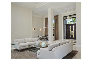Inspiration for a huge modern porcelain tile entryway remodel in Miami with gray walls and a dark wood front door