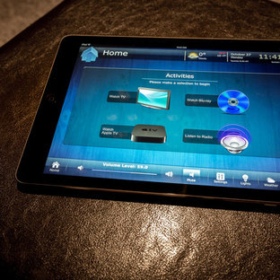 Inspiration for a mid-sized timeless enclosed carpeted and gray floor home theater remodel in Calgary with gray walls and a projector screen