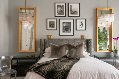 This is an example of a contemporary master bedroom in Las Vegas with grey walls and no fireplace.