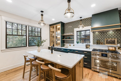 Enclosed kitchen - mid-sized traditional u-shaped light wood floor and brown floor enclosed kitchen idea in Other with a farmhouse sink, shaker cabinets, light wood cabinets, quartz countertops, green backsplash, ceramic backsplash, stainless steel appliances, an island and white countertops