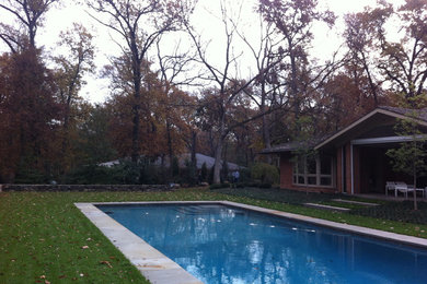 Mid-sized elegant backyard concrete paver and rectangular pool photo in St Louis