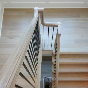Project #93 | Captivating Staircase with Light Wood and Black Spindles