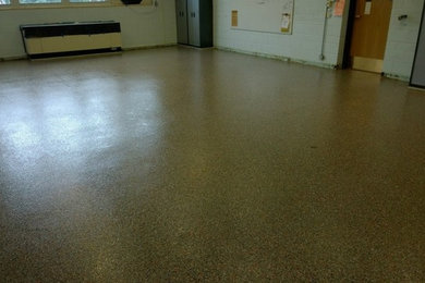 Inspiration for an industrial concrete floor basement remodel in Chicago