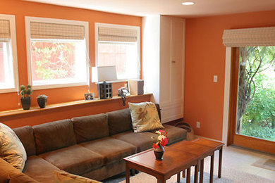 Living room - mid-sized contemporary enclosed ceramic tile living room idea in San Francisco with orange walls