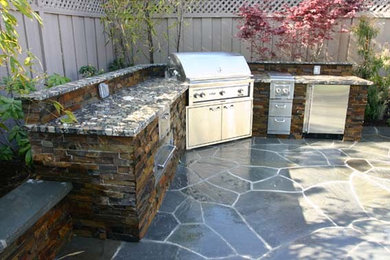 Patio kitchen - mid-sized backyard stamped concrete patio kitchen idea in Detroit with no cover