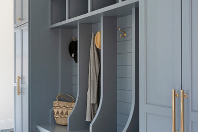 Inspiration for a mid-sized timeless multicolored floor mudroom remodel in Minneapolis