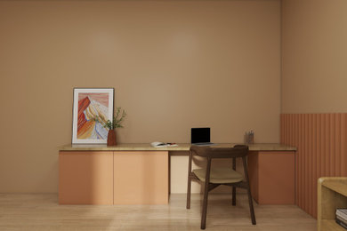 Example of a home office design in Toulouse with orange walls