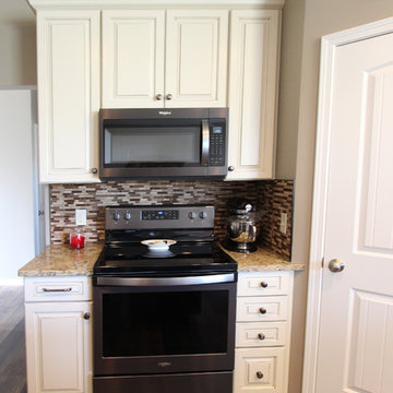 Cream Kitchen with Contrasting Dark Island with Quartz Countertop
