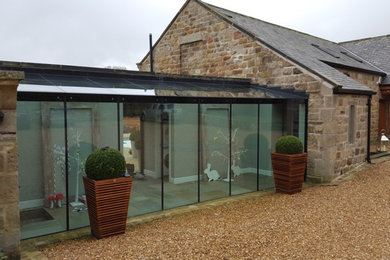 Contemporary house exterior in Other.