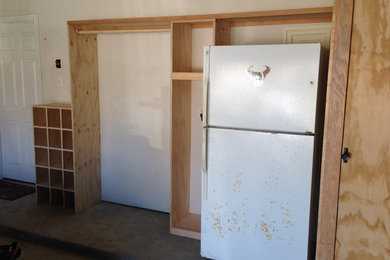Garage workshop - mid-sized craftsman attached two-car garage workshop idea in Houston