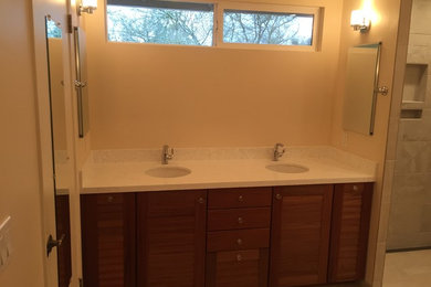 Large transitional master bathroom in San Francisco with engineered quartz benchtops, medium wood cabinets, an open shower, beige tile, ceramic tile, an undermount sink, an open shower and beige walls.