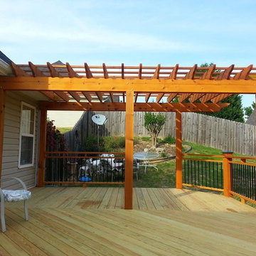 Deck with cedar pergola and custom rails