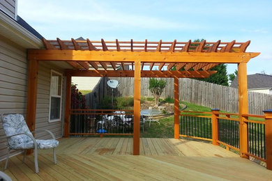 Deck with cedar pergola and custom rails